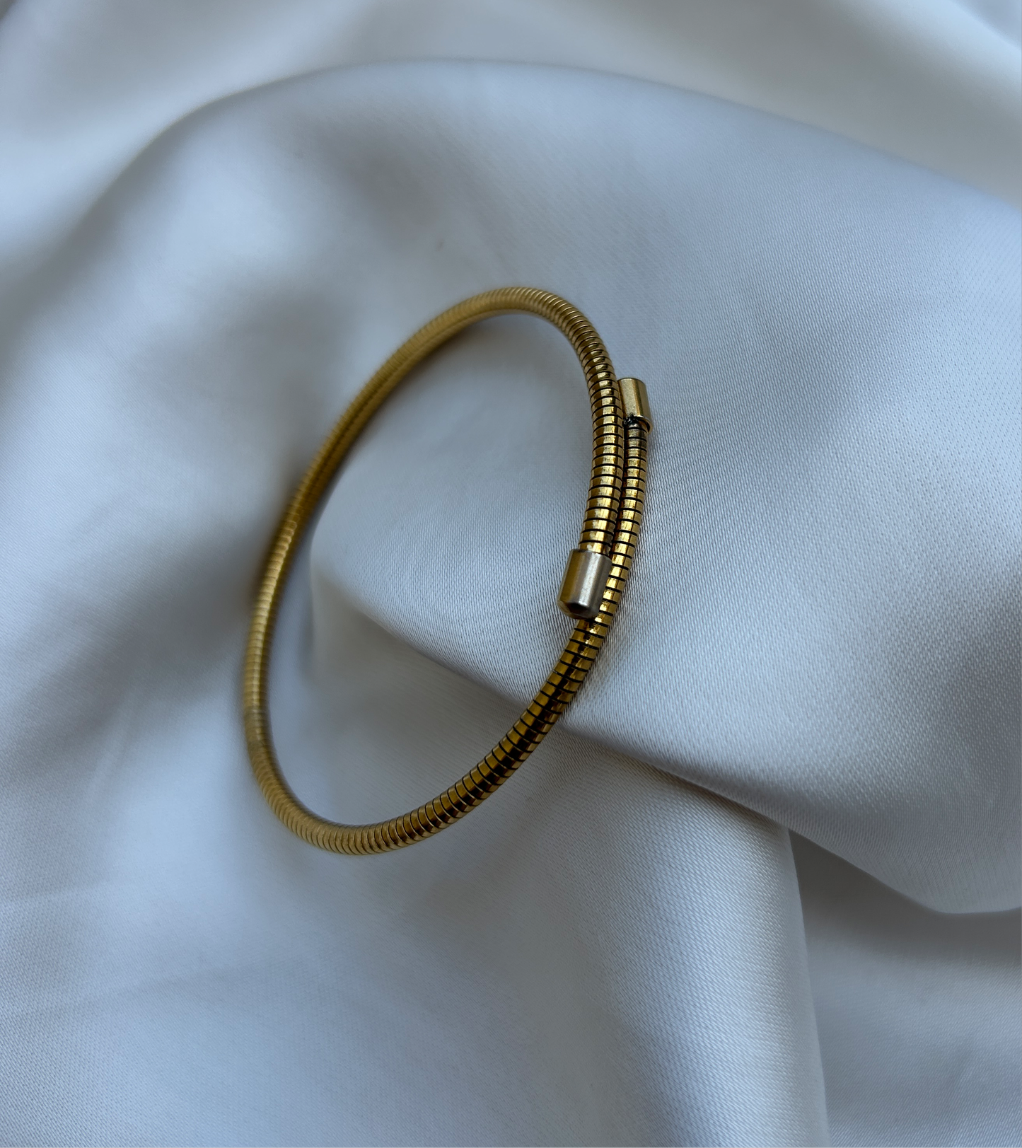 Wrap-around coiled bracelet